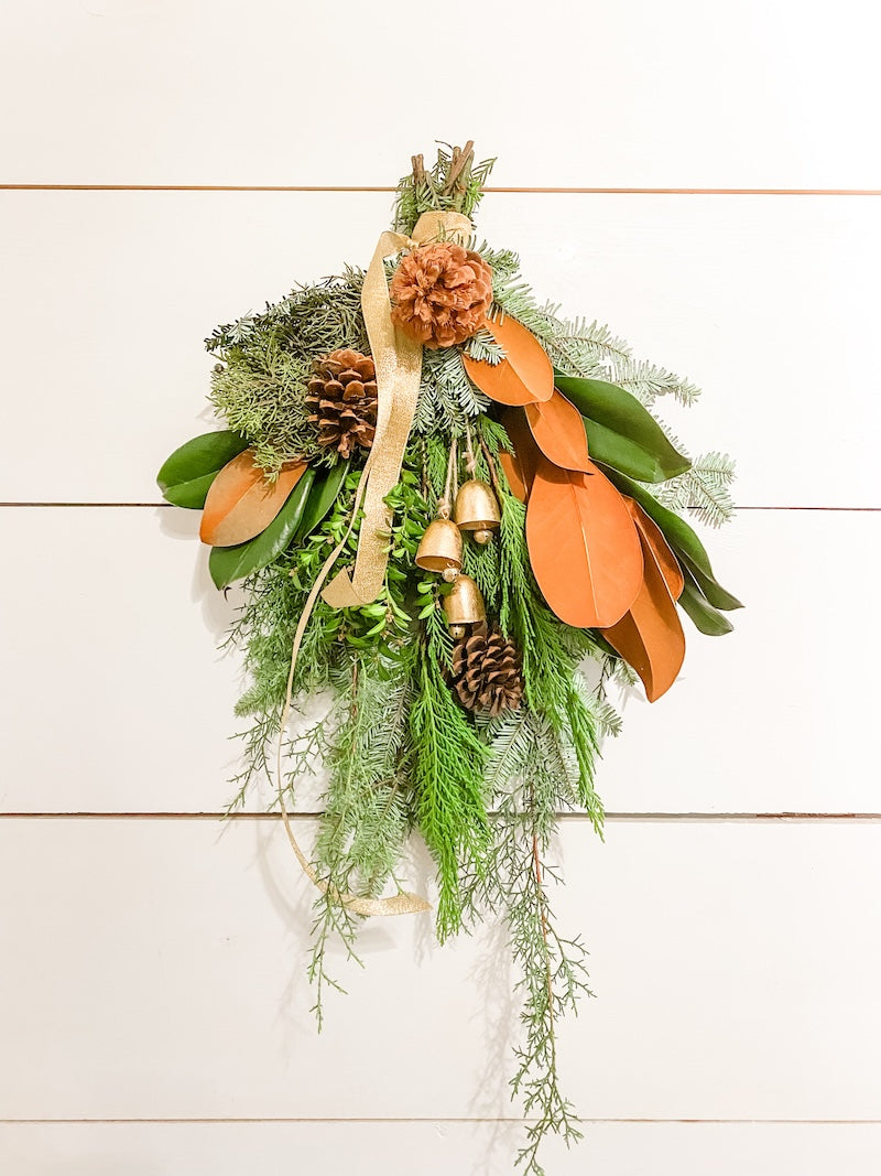 Door Swag with Magnolia, Pine Cones and Bells with Ribbon