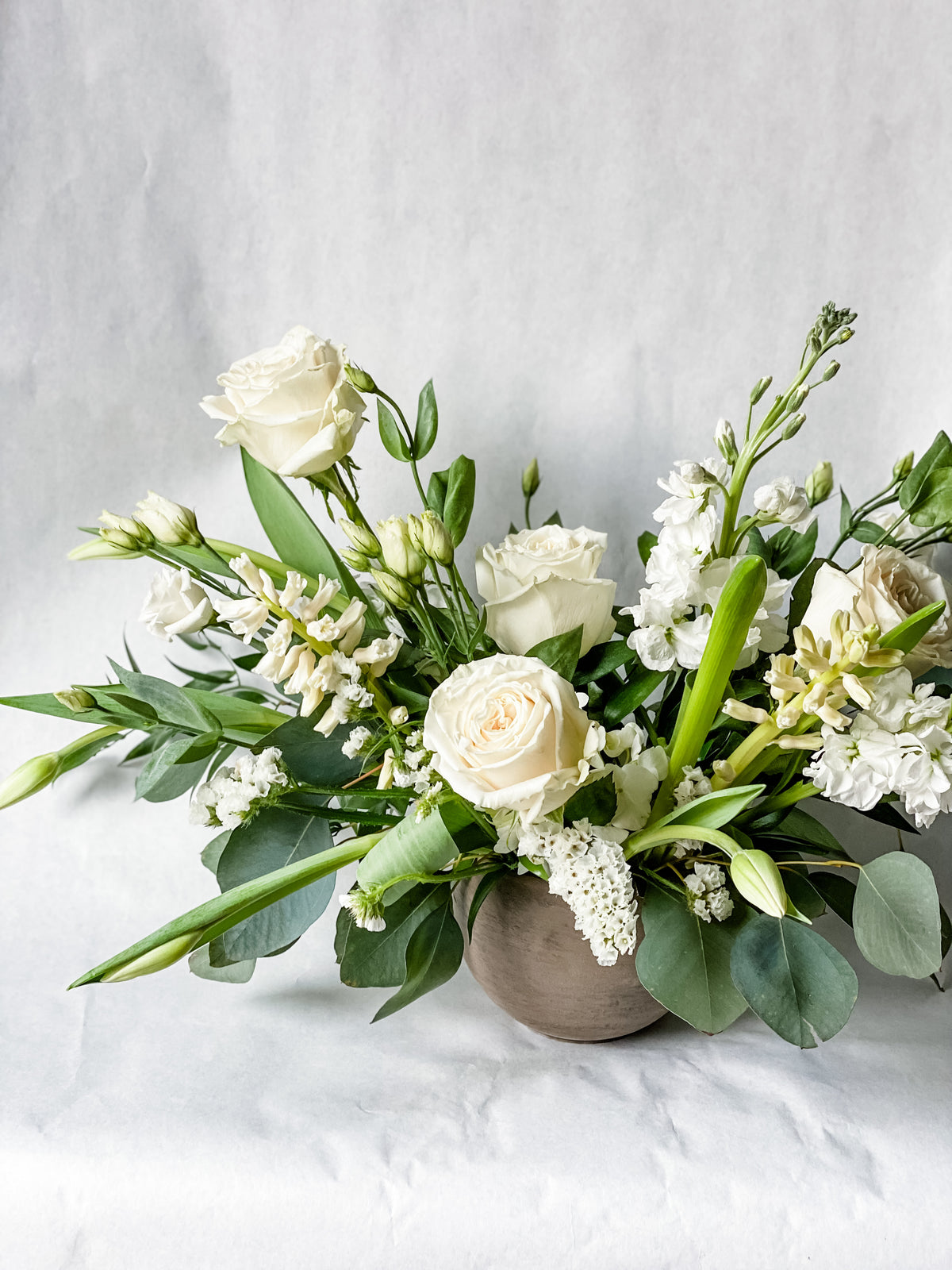 Beautiful seasonal vase arrangement of neutrals and ivory blooms